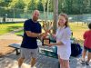 patti-miller-and-crestview-manager-holding-pioneer-cup-2022